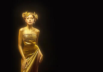 Portrait Beauty fantasy woman queen, face in gold paint. Golden shiny glowing skin. Fashion model...