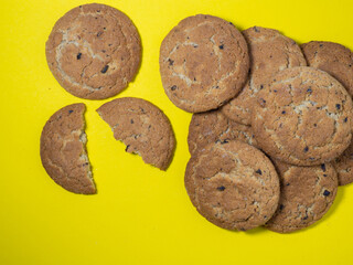 Oatmeal cookies on a yellow background. Cookies with raisins on the table. Background. Sweet treat.