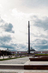 Fototapeta premium building, architecture, museum in the park, blue sky and clouds and ladder