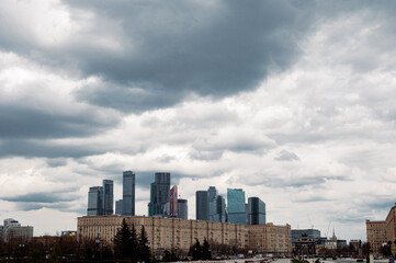 Naklejka premium big city, skyscrapers, skyline and blue clouds 