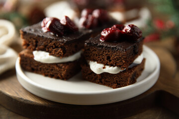 Chocolate cake with cherries and cream