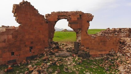 Aerial zoom in view Ani wall ruins in Turkey, Kars. Archeological site of medieval armenian city