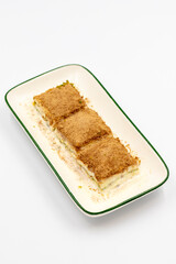 Cold baklava. Baklava with milk isolated on a white background. Mediterranean cuisine delicacies. Close-up. Local name soguk baklava
