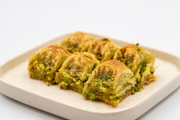 Pistachio baklava. Baklava with pistachio isolated on a white background. Mediterranean cuisine delicacies. Close-up. local name cimcik baklava