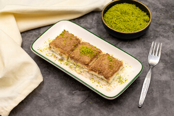 Cold baklava. Baklava with milk on a dark background. Mediterranean cuisine delicacies. Close-up. Local name soguk baklava