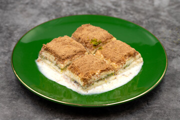 Cold baklava. Baklava with milk on a dark background. Mediterranean cuisine delicacies. Close-up. Local name soguk baklava