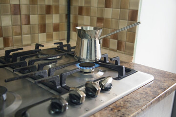 Coffee pot on gas stove.