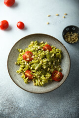 Pasta with pesto sauce and tomatoes