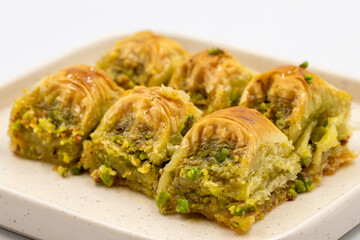 Pistachio baklava. Baklava with pistachio isolated on a white background. Mediterranean cuisine delicacies. Close-up. local name cimcik baklava