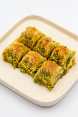 Pistachio baklava. Baklava with pistachio isolated on a white background. Mediterranean cuisine delicacies. Close-up. local name cimcik baklava