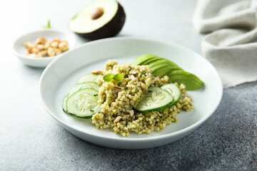 Couscous with pesto, cucumber and avocado