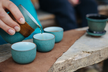 person holding a cup of tea