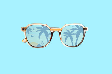 Summer sunglasses with palms in a mirror isolated on blue background