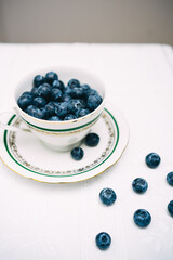 blueberries in a bowl on the table