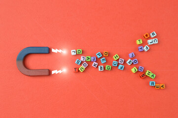The magnet attracting colorful alphabet beads