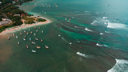 Ocean fishing boats, top view, drone shot.