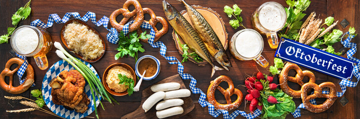 Festive served table with Bavarian specialities. Oktoberfest menu