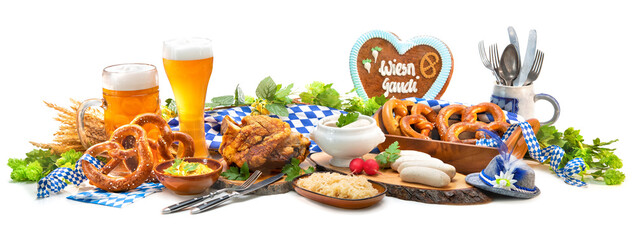 Festive served table with Bavarian specialities. Oktoberfest menu