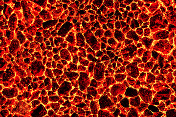 Smoldering coal in a burning furnace. The texture of natural stone. Red fire background.