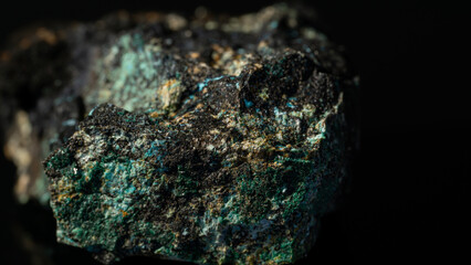 Closeup of a Chalcocite, copper sulfide isolated on a black background - obrazy, fototapety, plakaty