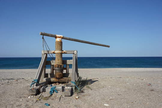 Old wooden boat winch at a beach at Cabo de Gata-Nijar natural park