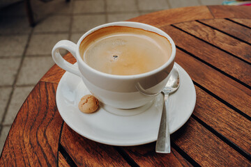 cup of coffee on a wooden table