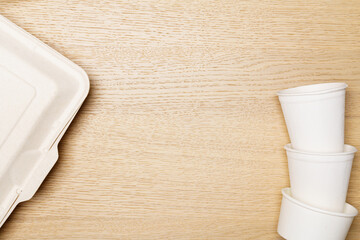 Eco friendly concept, Food container set and paper cup of biodegradable on wooden background