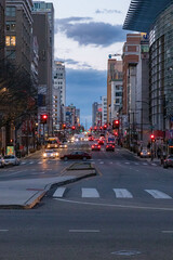 Fototapeta na wymiar Cars Driving at Sunset by Buildings in Philadelphia
