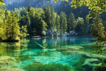 Magnificent view of the Blausee (Blue Lake) in iridescent turquoise tones, Switzerland