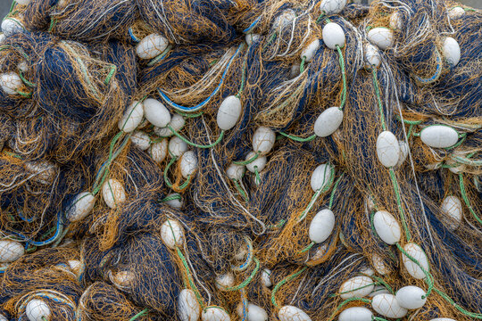 Closeup of a tangled nyl fishing net with white floats