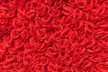 Bunch of artificial Rose flowers. Party Textil wreath. Festival Wedding Background Celebrate red flowers background