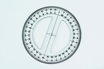 Closeup shot of a 360 degree plastic circular protractor isolated on a white background