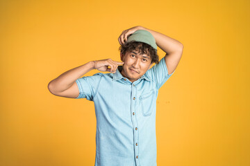 portrait of confident young asian man pose fun on isolated background