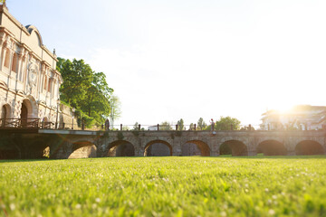 Italian park with green grass. Beautiful blurred background