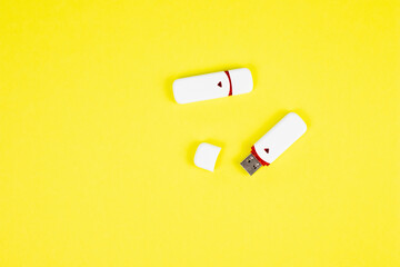 USB flash drive on a yellow background