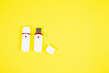 USB flash drive on a yellow background