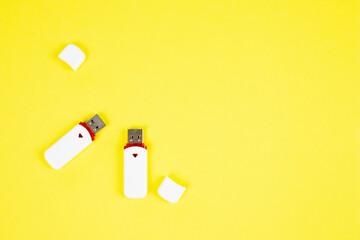 USB flash drive on a yellow background