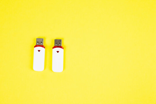 USB flash drive on a yellow background