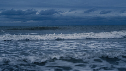 Obraz na płótnie Canvas Storm waves crashing landscape background. Ocean water thunder splash coast line