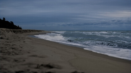 Fototapeta na wymiar Beach storming sea waves in dark ocean landscape background. Nature concept.