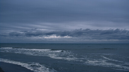 Fototapeta premium Sea splashing landscape background in evening sky beach. Ocean nature concept.