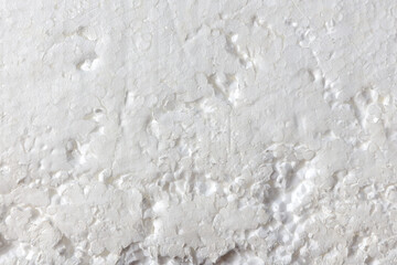 Fototapeta premium texture of a white foam sheet with scratches and damage on the surface