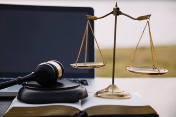 Judge gavel and legal book on wooden table, justice and law concept