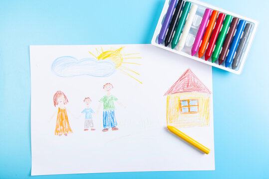 children's drawing family with wax crayons