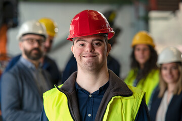 Young man with Down syndrome working in industrial factory, social integration concept.