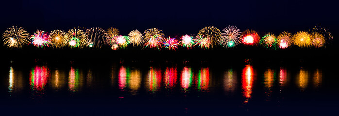 Banner of bright colored fireworks on a festive night. Explosions of colorful salute in the sky...