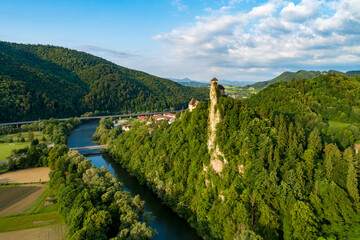 Orava castle - Oravsky Hrad in Oravsky Podzamok in Slovakia. Medieval stronghold on extremely high and steep cliff by the Orava river. Aerial view in sunrise light in summer. - 503175705