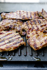 Barbecue with juicy pork neck steaks