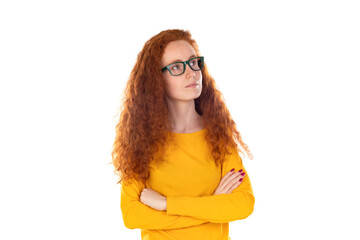 Head shot studio portrait young serious red-headed woman wearing blue t-shirt glasses looking at camera pose on grey white blank, spectacles eyewear offer