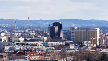 View over the skyline of Graz during Winter with the new Reininghaus district under construction